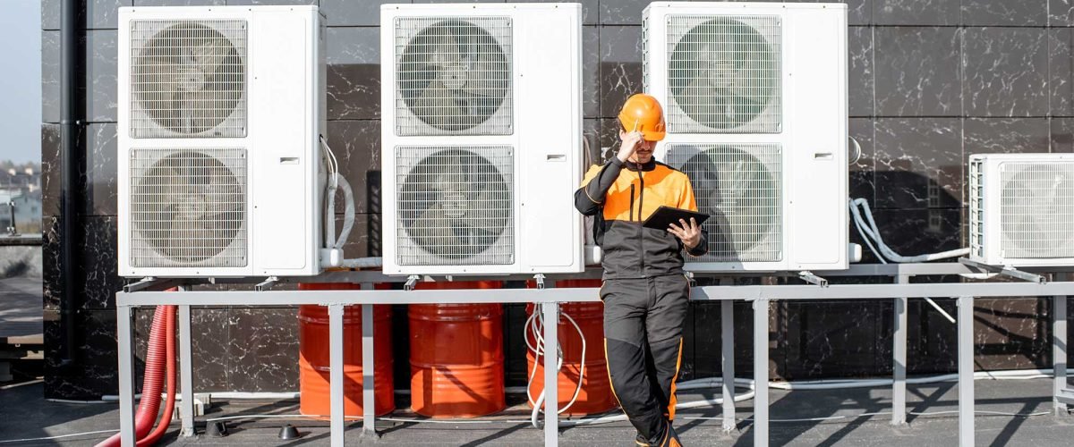 workman-servicing-air-conditioning-or-heat-pump-wi-2021-09-01-16-05-40-utc